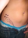 galaxy tattoo on side stomach